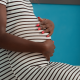 Picture of pregnant woman's arms holding her stomach
